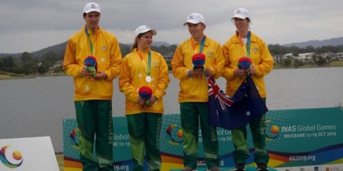 Aaron Skinner and the Australian team on the podium collecting Silver in the Mixed Four (coxed) 500m